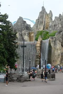 Visitors walking near the iconic artificial mountain at Wonderland Stock Photos