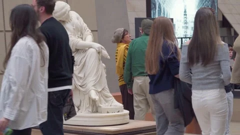 Visitors Walking past Penelope Marble Sculpture by Jules Cavelier inside Musée Stock Footage 339937402