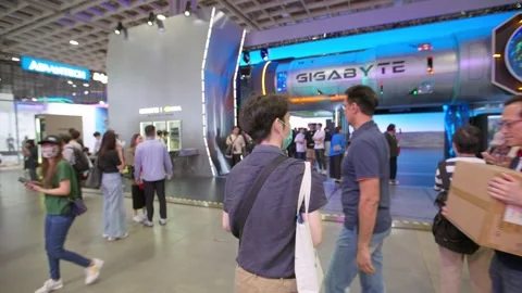 Visitors walking through Computex Taipei event Stock Footage 335479317