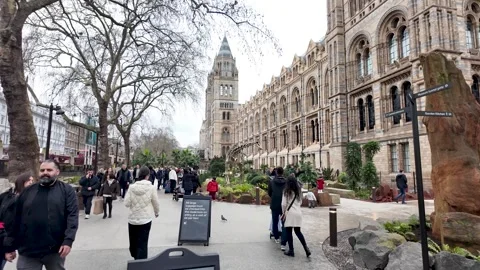Visitors walking through Evolution Garden towards the iconic facade of Natural 動画素材 331193236