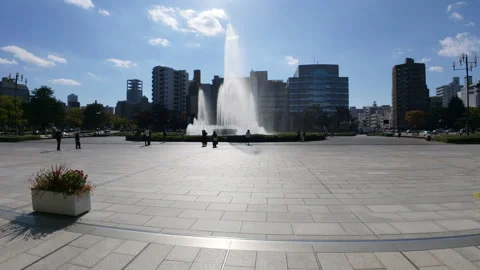 Visitors walking through of the Hiroshima Peace Memorial Park in Japan Stock-Footage 335543332