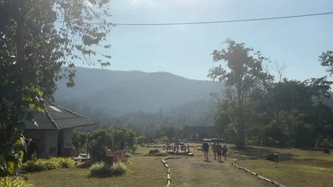 Visitors Walking Through Landscape at Bua Tong Sticky Waterfalls National Park Vídeo Stock 331159505