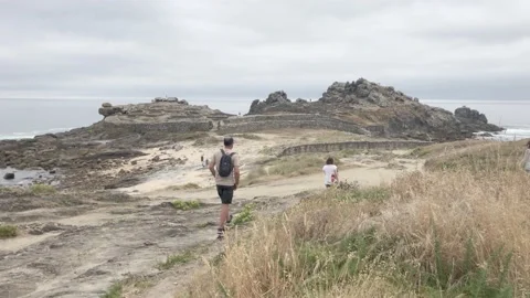 Visitors walking towards Castro celtic historical settlement Stock Footage 137906783