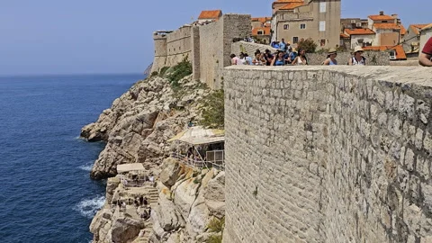 Visitors walking wall of Old Town Dubrovnik Video stock 294286186