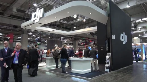 Visitors watching drones by DJI company on exhibition Cebit 2017 in Hannover Stock Footage 74364847