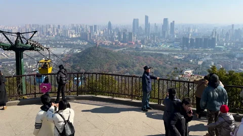 Visitos on sightseeing platform on summit of Huishan Stock Footage 296635951