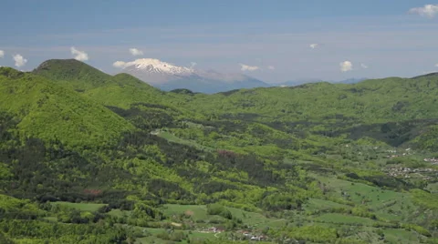 Vista of the Rhodope mountain chain in early spring. Green hills and freshness. Stock Footage 59363172