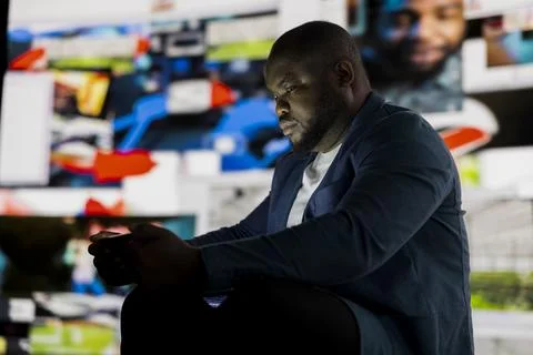 Visual concept of digital dependence as black individual faces stress 스톡 사진