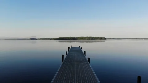 A Visual Experience of Running Down the Dock to Jump in the Still Water Stock Footage 111527828