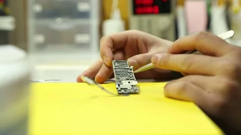 Visual inspection and Troubleshooting electronic circuit Board mobile Stock Footage 73616175