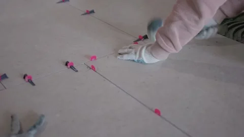Visual presentation of tile fitting procedures and tools used. Comprehensive Stock Footage 347879085