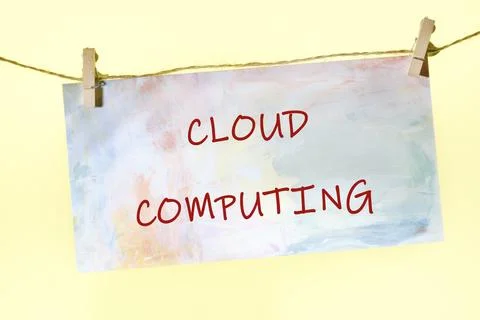 A visual representation of the term cloud computing hangs on a string, highli Stock Photos