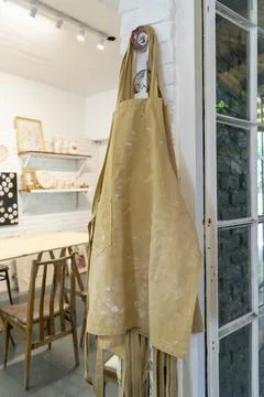 Visual story of a pottery studio featuring a well-loved apron Stock Photos