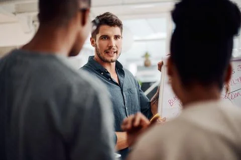 Visualising ideas goes a long way in business. a diverse group of businesspeople Foto stock