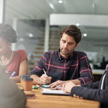 Visualising plans on paper. young creatives working in an office. Foto stock