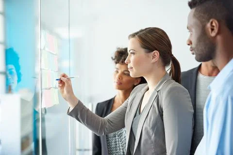 Visualising a winning idea come together. a group of colleagues having a Stock Photos