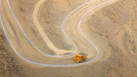 Visualization of a modern quarry. A dump truck drives through a large open pit 库存影片 167442745