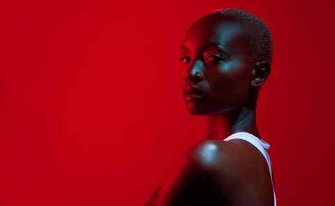 Visualize your highest self and show up as her. Red filtered shot of a beautiful Stock Photos
