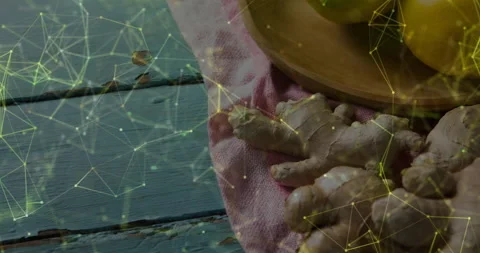 Visualizing kitchen tabletop displaying fresh ginger roots and lemons under Stock Footage 308027041