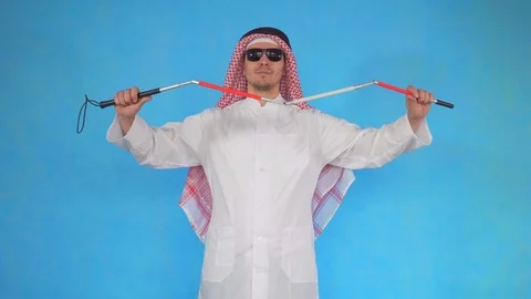 Visually impaired Arab man disabled with a cane Stock Footage 106989851