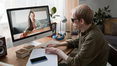 Visually Impaired Man Having Video Call with Young Woman on Computer Stock-Footage 288829059