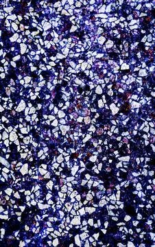 Visually striking terrazzo surface with vibrant blue and violet stone chips Stock Photos