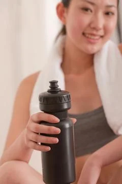 Vitality Bottle Slim Alone Exercise hand Adult Vertical composition Women Face Stock Photos