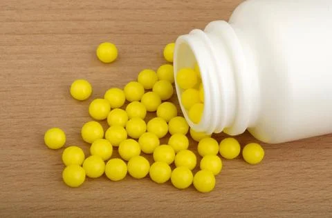 Vitamin, ascorbic acid ascorbic acid in plastic pot on wooden background C... Stock Photos