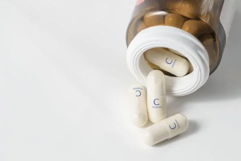 Vitamin C. Ascorbic acid capsules are essential for wound healing and promote Stock Photos
