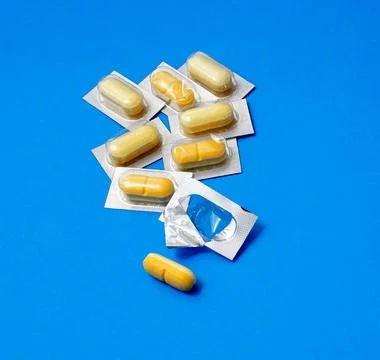 Vitamin C pills on blue background,Ascorbic Acid Tablets Stock Photos