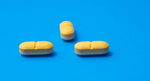 Vitamin C pills on blue background,Ascorbic Acid Tablets Stock Photos