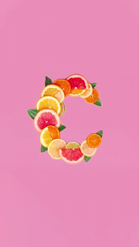Vitamin C on pink background, slice of citrus orange, lemon flat lay creative Stock Footage 271729934
