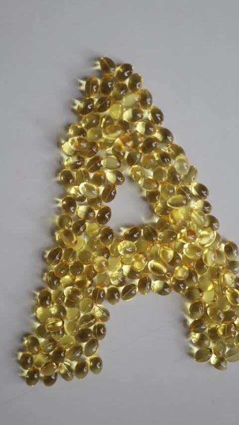Vitamin A capsules arranged in the shape of letter A Vidéo 342610261