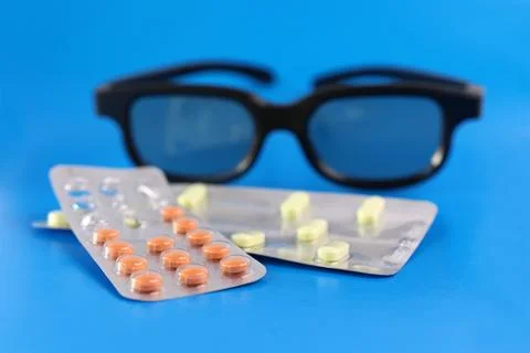 Vitamin complex capsules to improve vision and glasses. Prevention and trea.. Stock Photos