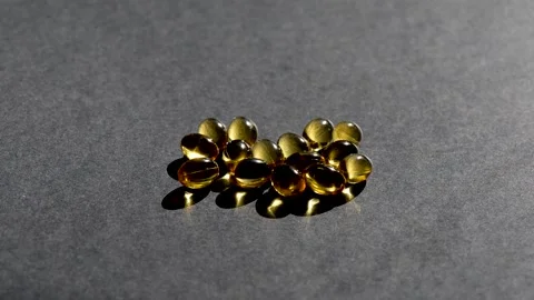 Vitamin D capsules. black background. Biologically active additives Stock Footage 149182772