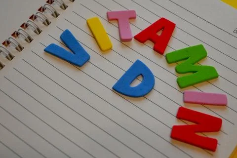 Vitamin D letters on a lined notebook Stock Photos