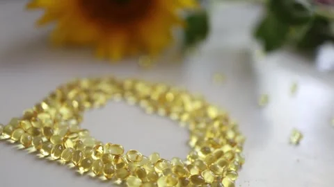 Vitamin D softgel capsules forming a large letter D for health and nutrition Video stock 344043932