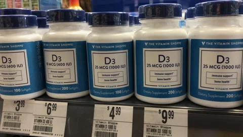 Vitamin D3 Immune support supplements. Displayed on shelves at Vitamin Shop Stock Footage 133482662
