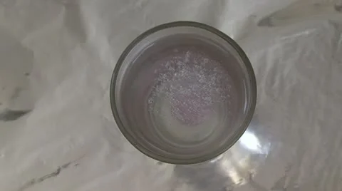 Vitamin dissolves in water Stock Footage 10825658