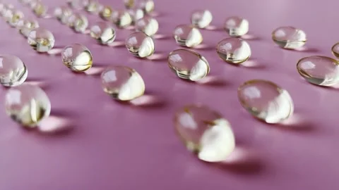 Vitamin E capsules on light pink background Stock Footage 172491818