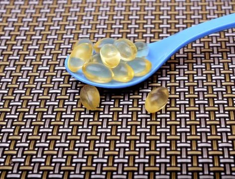 Vitamin E supplement on Spoon close up Stock Photos