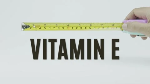 Vitamin E text or word and tape measure on a white background Vídeo Stock 302127419