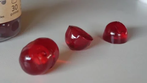 Vitamin gummies close-up on white surface Video stock 319522470