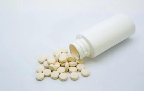 Vitamin Tablets with Bottle Stock Photos