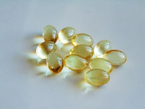 Vitamina D3 pills - isolated on white Stock Photos