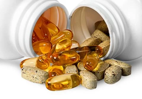 Vitamins and fish oil capsules together Stock Photos