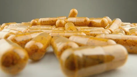 Vitamins and nutritional supplements in capsule form to support health. Capsules Video stock 255933645