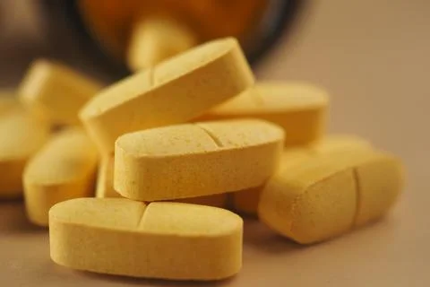 Vitamins and supplements on a plain surface Stock Photos