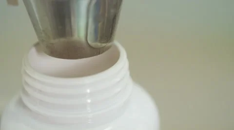 Vitamins Being Counted and Poured into Bottles Stock Footage 50032207