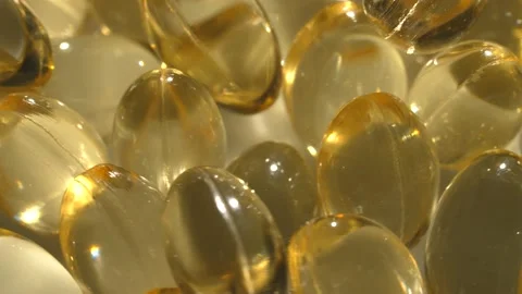 Vitamins D, capsules omega 3, macro Stock Footage 231794409